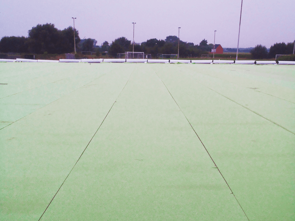 Defender is installed underneath the playing surface of an athletic field